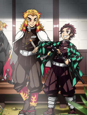 Rengoku And Tanjiro In An Intense Battle Wallpaper