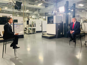 Renowned Journalist David Muir Interviewing Former President Donald Trump Wallpaper