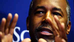 Renowned Neurosurgeon And Politician Ben Carson In Discussion Wallpaper