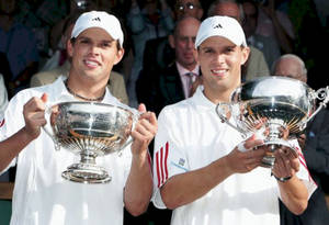 Renowned Tennis Duo Mike & Bob Bryan Celebrating Victory Wallpaper