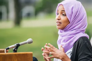 Rep. Ilhan Omar Giving An Inspiring Speech Wallpaper