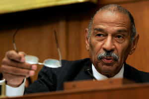 Representative John Conyers In A Formal Meeting Wallpaper