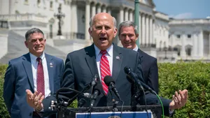 Representative Louie Gohmert Delivering A Speech Outside The Capitol Building Wallpaper