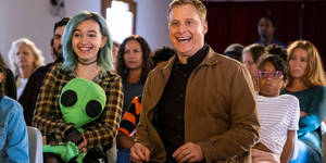 Resident Alien With Dr. Harry's Daughter Wallpaper