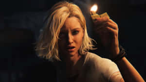 Resident Evil Requiem Claire Lighting Candle Wallpaper