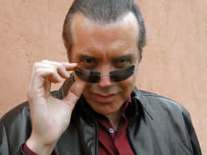 Respected Actor Chazz Palminteri Posing For A Photoshoot Wallpaper