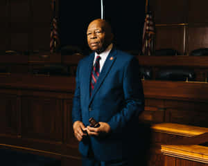 Respected Statesman Elijah Cummings In Sophisticated Blue Suit Wallpaper