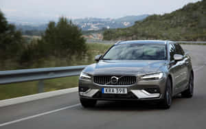 Responsive And Unwavering Volvo V60 On Open Road Wallpaper