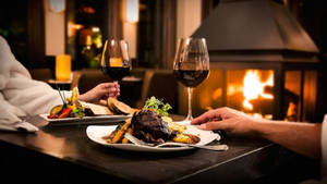 Restaurant Steak Dinner Over Fireplace Wallpaper