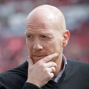 Retired German Footballer Matthias Sammer Stroking His Beard Wallpaper