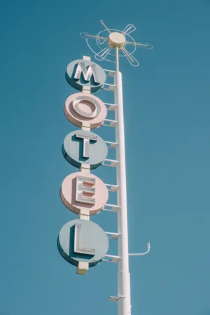 Retro Motel Sign Vertical View Wallpaper
