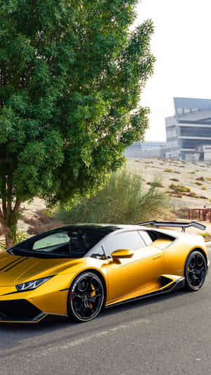 Rev Up Your Style With A Luxurious Gold Lamborghini. Wallpaper