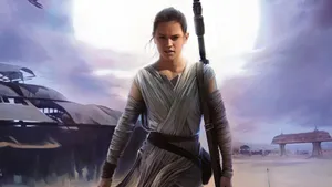 Rey, With Lightsaber In Hand, Prepares To Take On The Dark Side Wallpaper