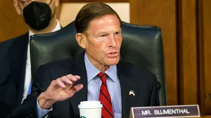 Richard Blumenthal Pondering With Coffee In Black Attire Wallpaper