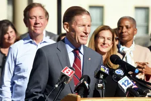 Richard Blumenthal Talking Into A Bunch Of Microphones Wallpaper