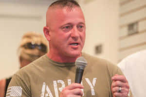 Richard Ojeda Holding A Microphone Wallpaper