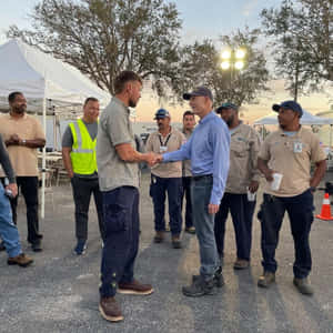 Rick Scott Shakes Hands With Worker Wallpaper