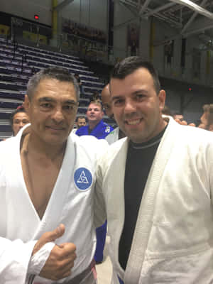 Rickson Gracie With Studentat Gym Wallpaper