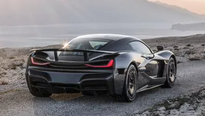 Rimac C_two Electric Hypercar In Blue Color On The Road Wallpaper