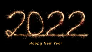 Ringing In 2022: A Beacon Of Hope And Celebration Wallpaper