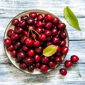Ripe Black Cherry Hangs On A Branch, Ready For Harvest Wallpaper