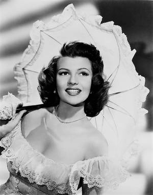 Rita Hayworth Holding A Parasol Wallpaper