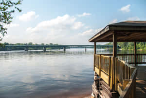 Riverside Gazeboand Bridge View Wallpaper