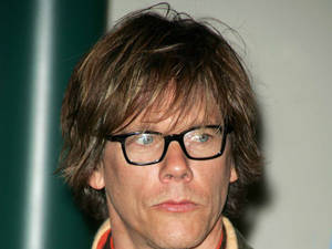 Riveting Hollywood Actor Kevin Bacon Sporting A Long Hairstyle Wallpaper