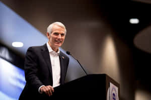 Rob Portman Delivers A Speech From Podium Wallpaper