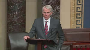 Rob Portman Talking Hand On Podium Wallpaper