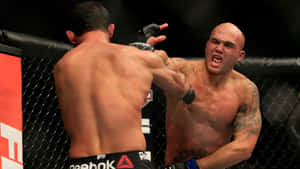 Robbie Lawler Lands A Hit On Johny Hendricks Wallpaper