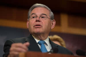 Robert Menendez On A Podium Wallpaper