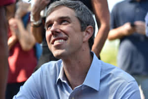 Robert O'rourke Addressing A Public Gathering. Wallpaper