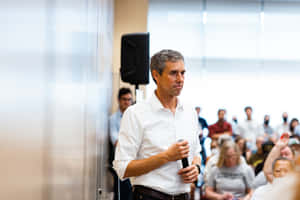 Robert O'rourke During A Public Speaking Event Wallpaper