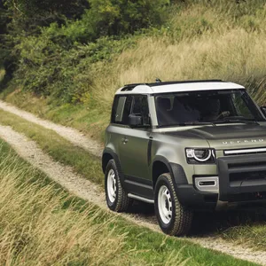Robust Land Rover Defender In Its Natural Habitat Wallpaper