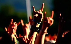 Rock Concert Devil Horns Gesture Wallpaper