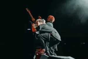 Rock Concert Energy Guitaristand Singer Wallpaper