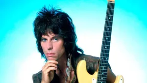 Rock Guitarist Blue Backdrop Wallpaper