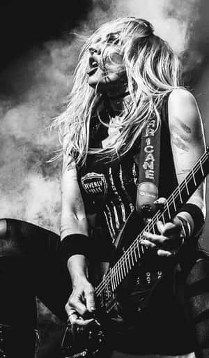 Rock Guitaristin Action.jpg Wallpaper