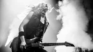 Rock Guitaristin Action.jpg Wallpaper