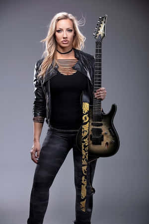 Rock Guitaristwith Black Electric Guitar Wallpaper