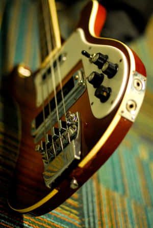 Rock Out With A Bass Guitar Wallpaper