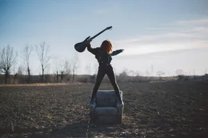 Rock Rebellion Sunset Guitarist.jpg Wallpaper