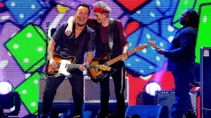 Rockstars Performing On Stage Wallpaper