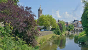 Roermond River Viewwith Church Tower Wallpaper