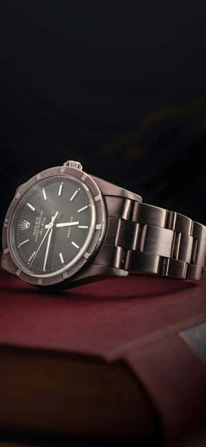 Rolex Watch On Book Surface Wallpaper