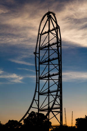 Roller Coaster With Towering Arch Top Wallpaper