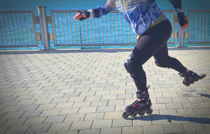 Rollerblading Along The Seaside Wallpaper