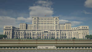 Romanian Parliament Buildings Silhouetted Against A Dark Sky Wallpaper