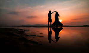 Romantic Beach Sunset Couple Wallpaper